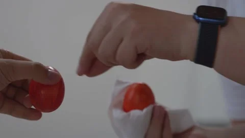 Two men traditionally beat eggs at Easter. Easter holiday and tradition Stock Footage 214501580