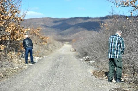 Two men urinating Stock Photos