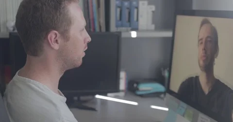 Two men on a video conference call in home office Stock Footage 78037535
