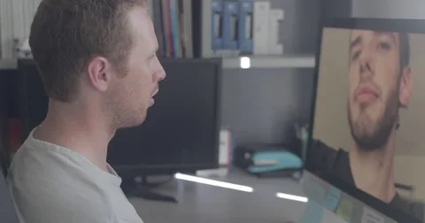 Two men on a video conference call in home office Stock Footage 78037551