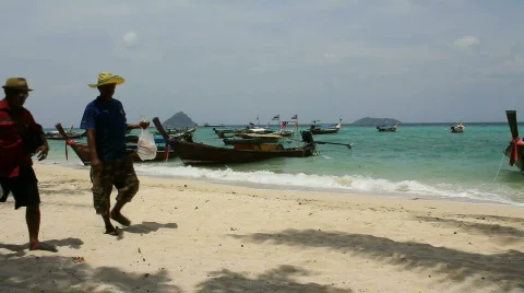 Two Men Walk Down Beach Stock Footage 664366