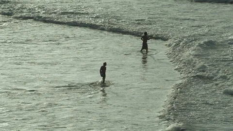 Two Men Walk Into Ocean Видео 94101722