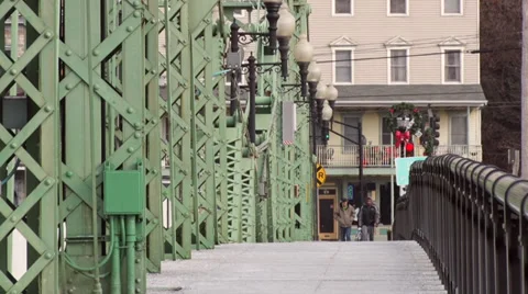 Two men walk over the Northampton Street Bridge in Fall. Stock Footage 35517224