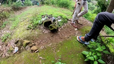 Two men walked over to their friend and then one sat down Video stock 278963075