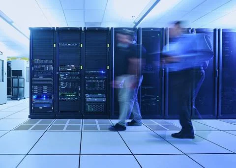 Two men walking in data center Stock Photos