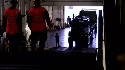 Two Men Walking Down a Ramp Wearing Safety Vest and Helmet Stock Footage 130360192