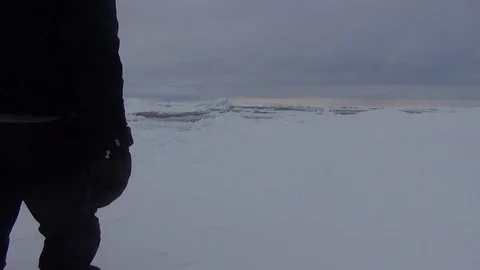 Two men walking on the ice floe, Arctic Ocean Stock Footage 104872613