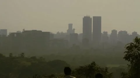 Two men walking past Mumbai skyline viewpoint. Stock Footage 11103845