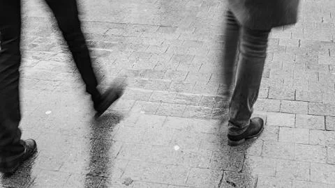 Two men walking in the rain Stock Photos
