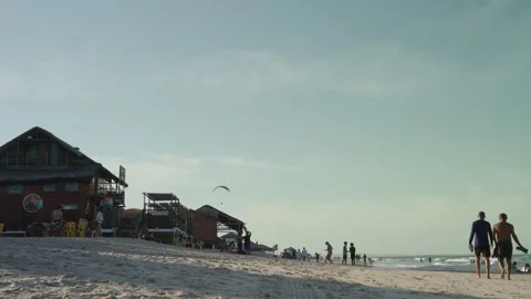 Two Men Walking on Sandy Beach in Aracati Brazil Video stock 327722248