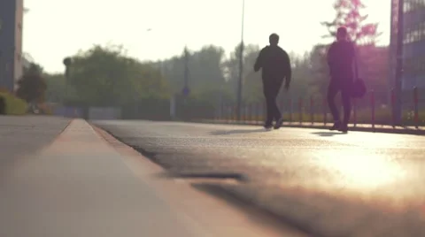 Two men walking on the street. Sunset time. Stock Footage 63554584
