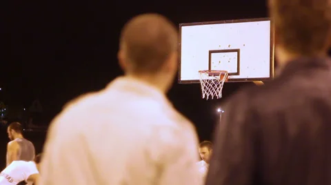 Two men watching basketball Stock-Footage 29352082