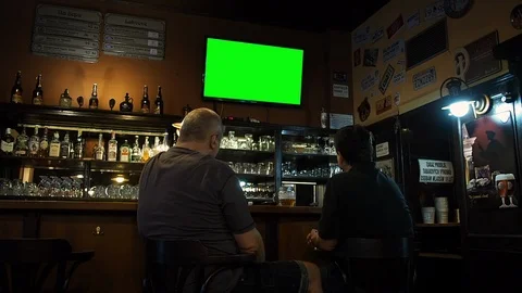 Two Men Watching TV Sports Pub Bar Stock Footage