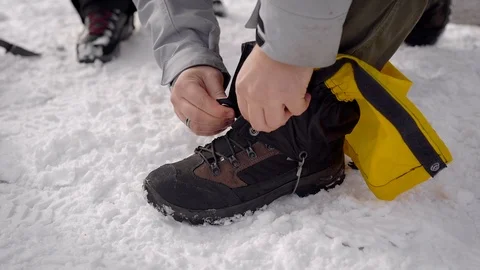 Two men went on an expedition. Professional trekking boots and leggings help to Stock-Footage 106581718
