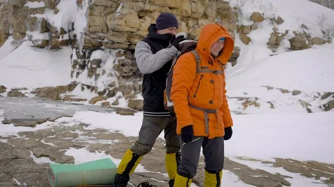 Two men went on a winter hike. Friends have professional equipment, they walk Stock-Footage 106582346