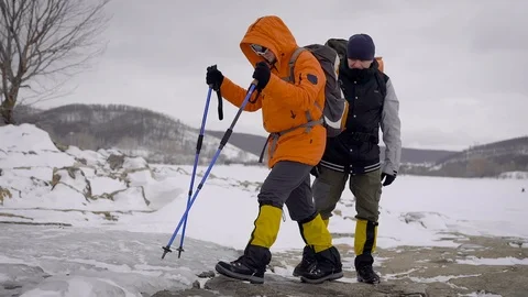 Two men went on a winter hike. Friends have professional equipment, they walk Stock-Footage 106582454