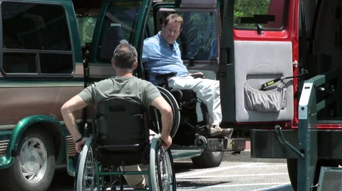 Two men in wheelchairs exit van 스톡 동영상 64827241