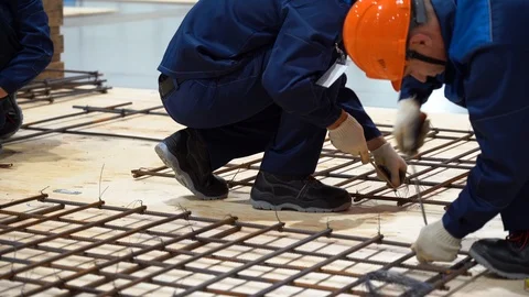 Two men work as construction workers. People install underfloor heating Stock Footage 126357058
