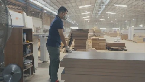 Two men work in a factory. Workflow in a furniture factory. Two Asian men work Video stock 112868608