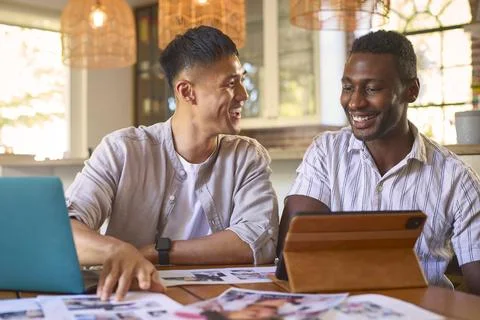 Two Men Work From Home In Design Publishing Or Creative Industry With Digital Foto stock