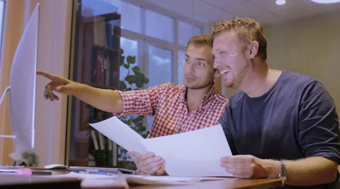 Two men work in office of construction company and discuss the working plan Stock Footage 58016158