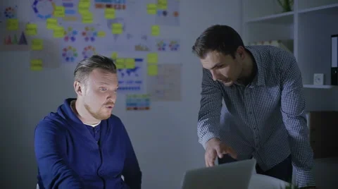 Two men work at office overtime Stock Footage 62550177