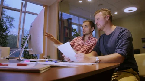 Two men work overtime over the project plan of construction of the house Video stock 58015752