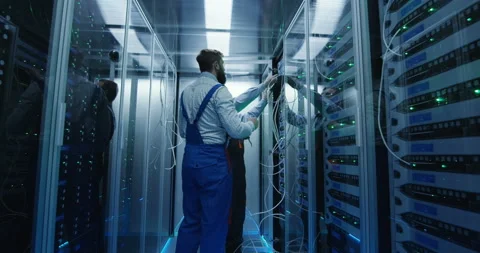 Two men working in a data center Stock Footage 98005180