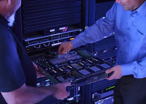 Two men working in data center Stock Photos