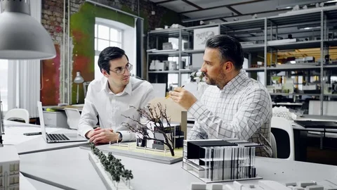 Two men working in design and engineering architecture office Stock Footage 85877900