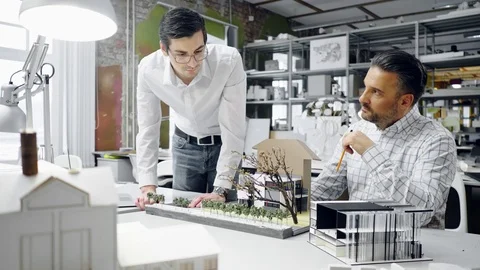 Two men working in design and engineering architecture office Stock Footage 85877920