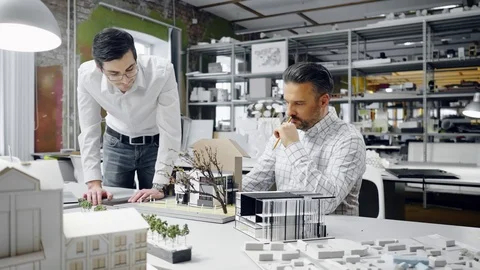 Two men working in design and engineering architecture office Stock Footage 85877924