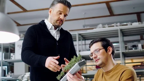 Two men working in design and engineering architecture office Stock Footage 86361861