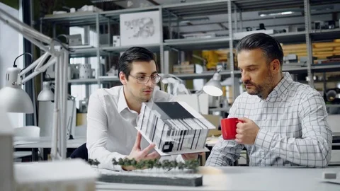 Two men working in design and engineering architecture office Stock Footage 86361945