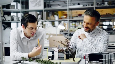 Two men working in design and engineering architecture office Stock Footage 86361960