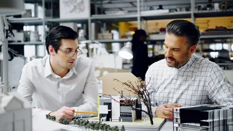 Two men working in design and engineering architecture office Stock Footage 86361972