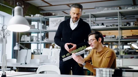 Two men working in design and engineering architecture office Stock Footage 86792149