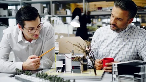 Two men working in design and engineering architecture office Stock Footage 86794728