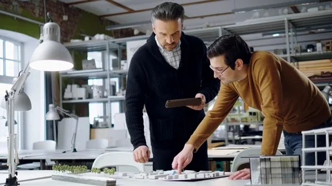 Two men working in design and engineering architecture office Stock Footage 86795215