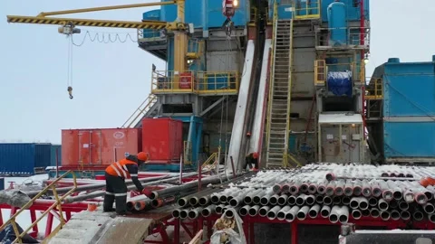 Two men working at a drilling station Stock Footage 143069436