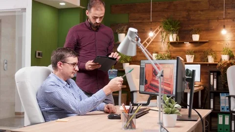Two men working in gaming development in the office Stock Footage 115071521