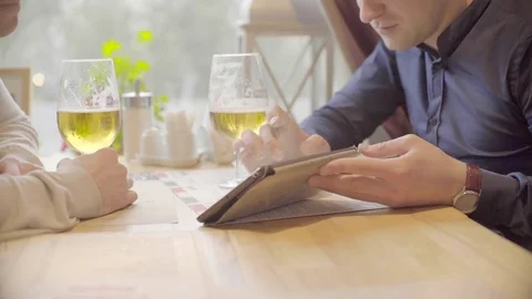 Two men working on the tablet and drinking beer in relaxed atmosphere Stock Footage 72619175