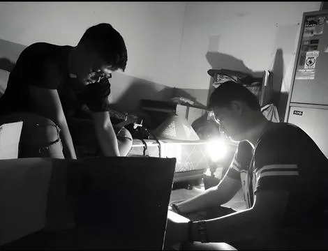 Two men works on a project Stock Photos