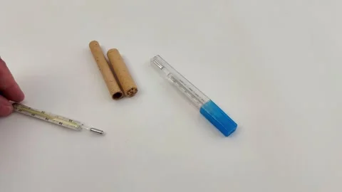 Two Mercury Thermometers Placed on White Background Surface Stock-Footage 330051220