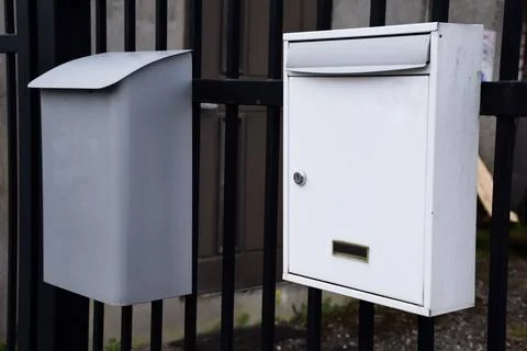 Two Metal Mailboxes Mounted on Black Iron Fence Outdoor Residential Fotos Stock