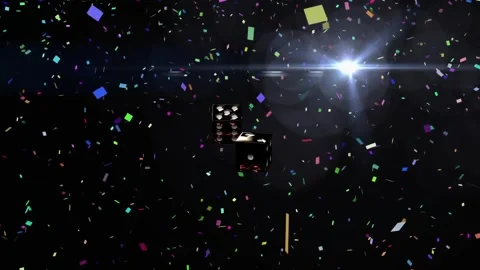Two metallic dice dropping from top tumbling inward with confetti while settling Stock Footage 340674756