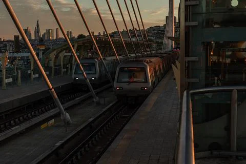 Two Metro Trains at Halic Bridge Station at Sunrise Stock Photos