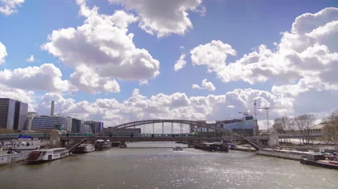 Two metro trains passing eachother outside on a bridge in Paris. Wide es Stock Footage 62408841