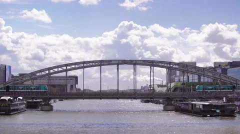 Two metro trains passing eachother outside on a bridge in Paris Stock Footage 62414399