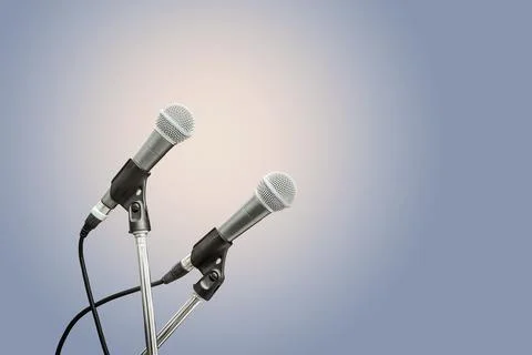 Two microphone blue background Fotos de archivo
